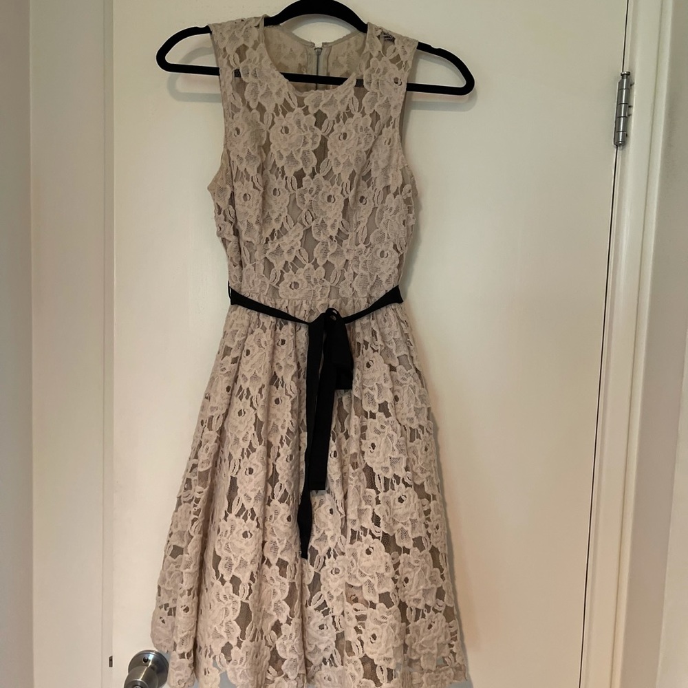Nude lace dress with black grosgrain ribbon belt